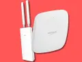 Due dispositivi per un **hot spot wifi** potente: un access point Cudy con antenne e un router Netgear Insight.