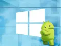 L'icona di Android si staglia fiera davanti al logo di Windows, un'unione di sistemi operativi su PC.