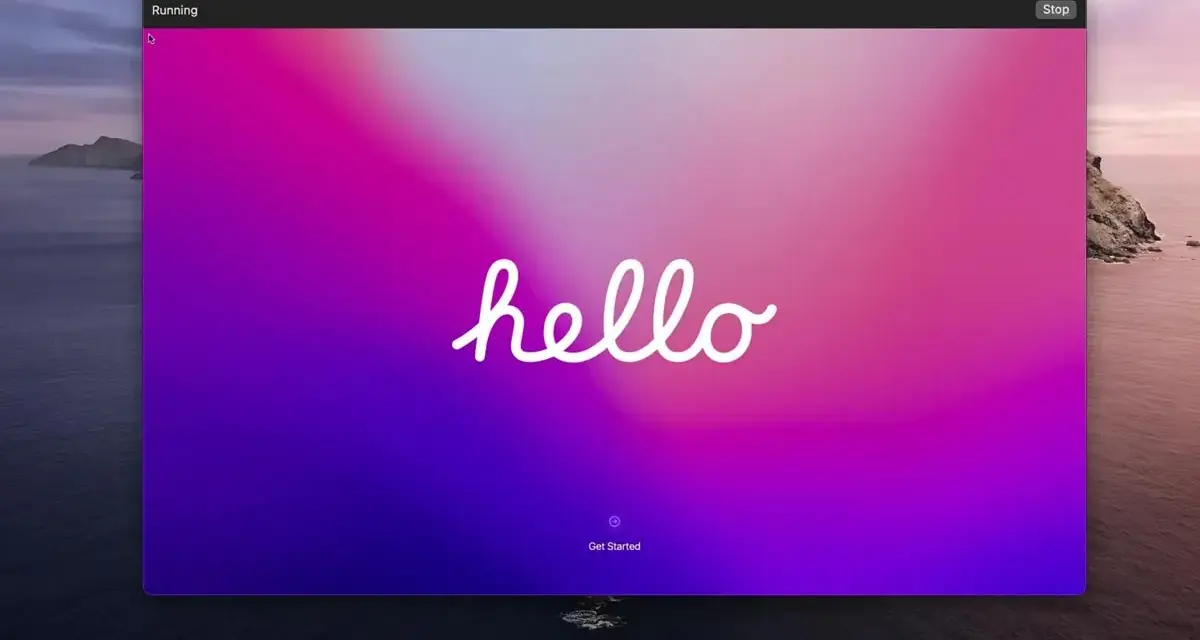 Schermata di avvio di una macchina virtuale con sfondo sfumato rosa-viola e la scritta "hello".