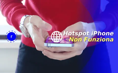 Mani che tengono un iPhone con testo sovrapposto: "Hotspot iPhone Non Funziona".
