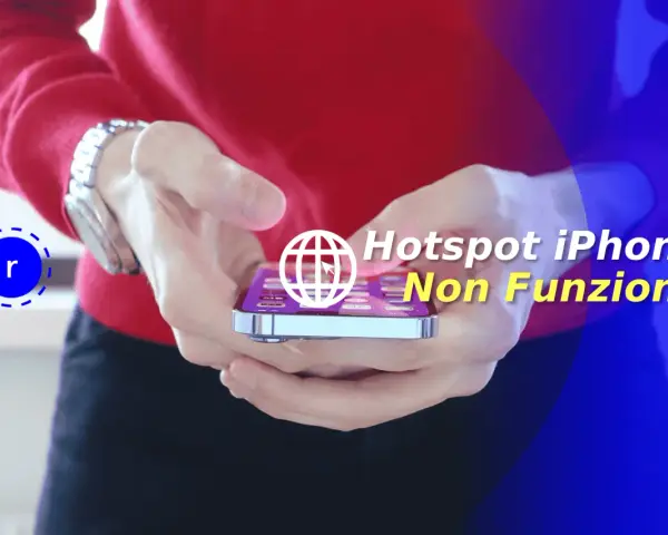 Mani che tengono un iPhone con testo sovrapposto: "Hotspot iPhone Non Funziona".